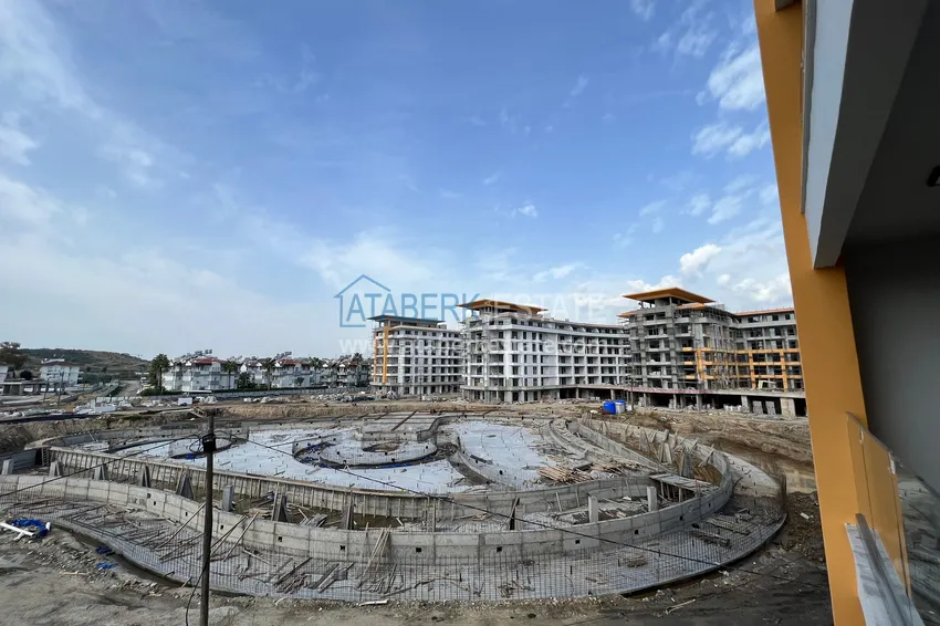 Фото - Квартира 1+1 площадью 85 м2 от инвестора в строящемся комплекс-отеле - Алания, район Тюрклер 10