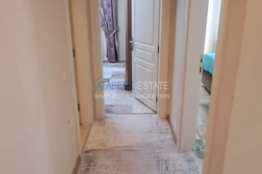 Приобрести Квартира 2+1 в Алании район Тосмур, меблированная с застекленным балконом. Недвижимость под ВНЖ 1 