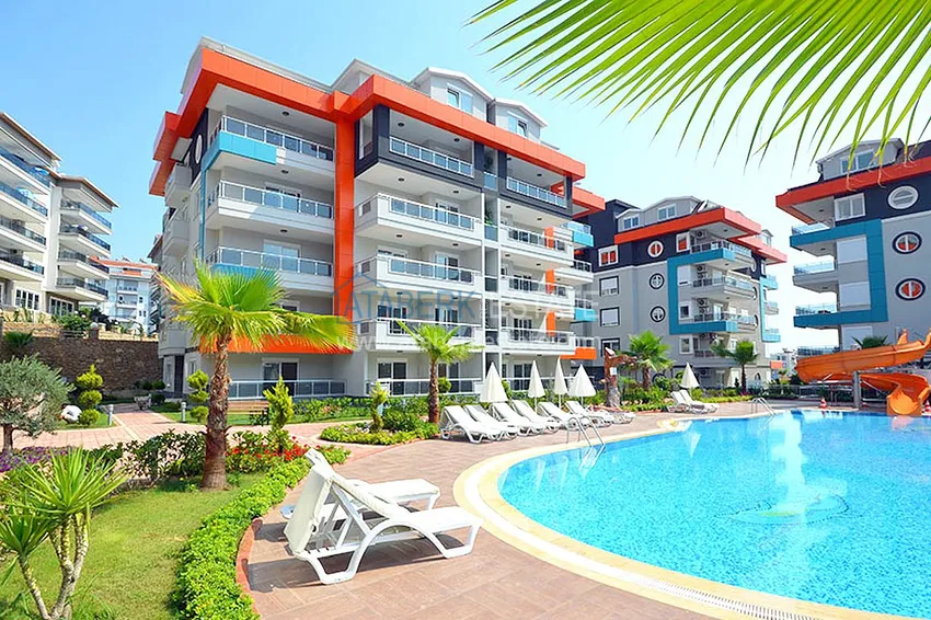 Квартира 1+1 меблированная с боковым видом на море, район Кестель – Алания 1