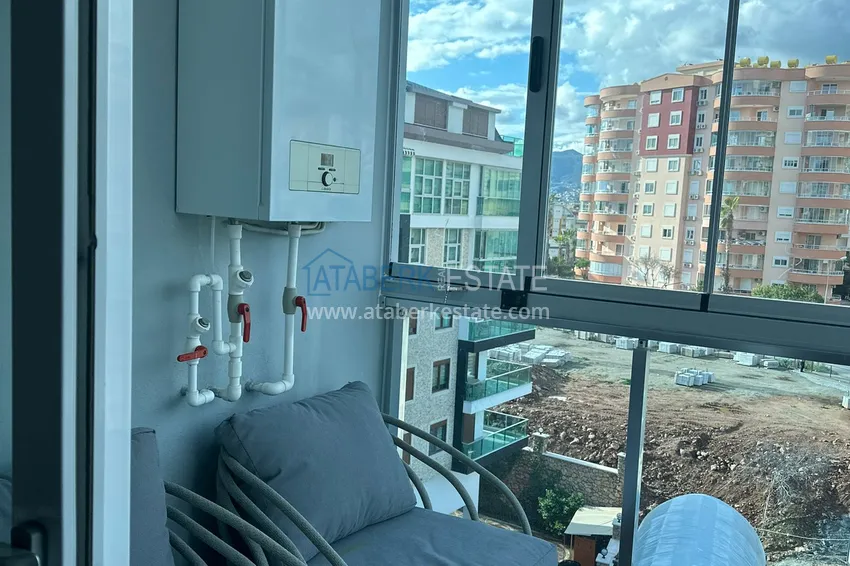 Приобрести Квартира с видом на море, 2 застекленными балконами и отоплением в 300 метрах от моря – район Тосмур 26