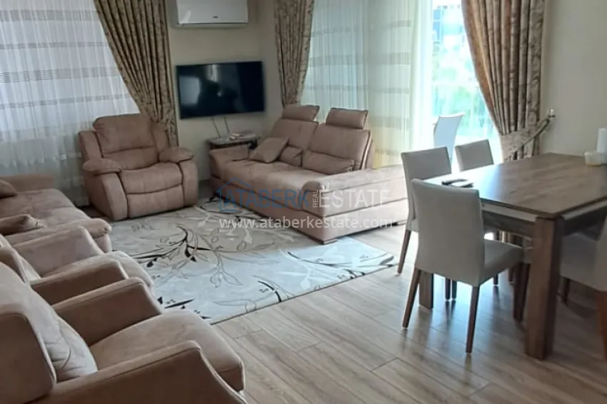 Приобрести Квартира 2+1 в Алании район Тосмур, меблированная с застекленным балконом. Недвижимость под ВНЖ 3 