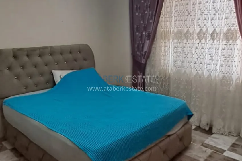 Приобрести Квартира 2+1 в Алании район Тосмур, меблированная с застекленным балконом. Недвижимость под ВНЖ 5 