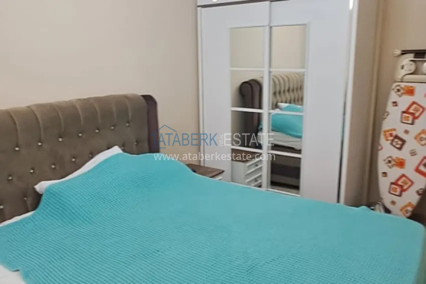 Приобрести Квартира 2+1 в Алании район Тосмур, меблированная с застекленным балконом. Недвижимость под ВНЖ 8 