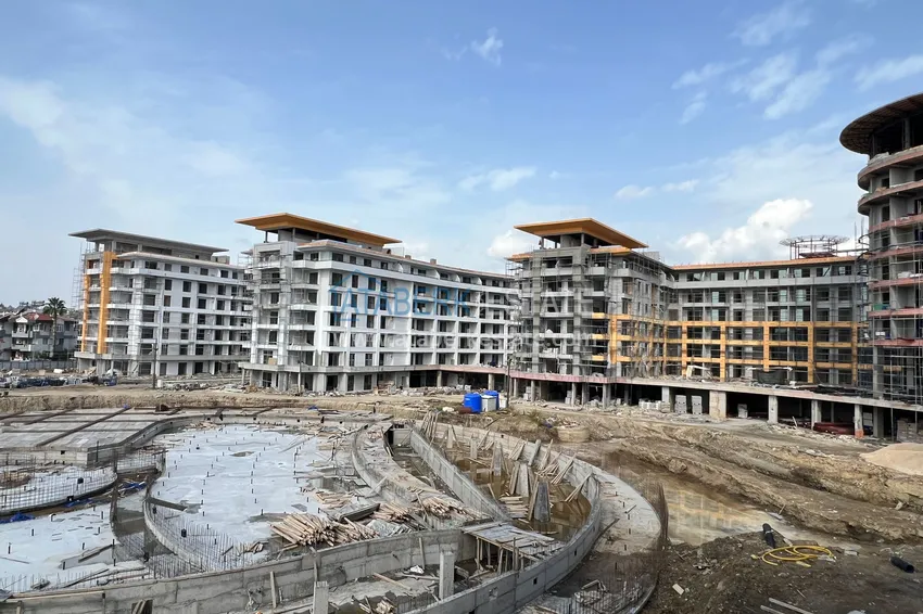 Фото - Квартира 1+1 площадью 85 м2 от инвестора в строящемся комплекс-отеле - Алания, район Тюрклер 8