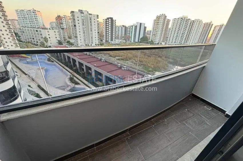 Приобрести Квартира 1+1 в новом жилом комплексе в 300 метрах от моря Арпачбахшиш – Мерсин 9 