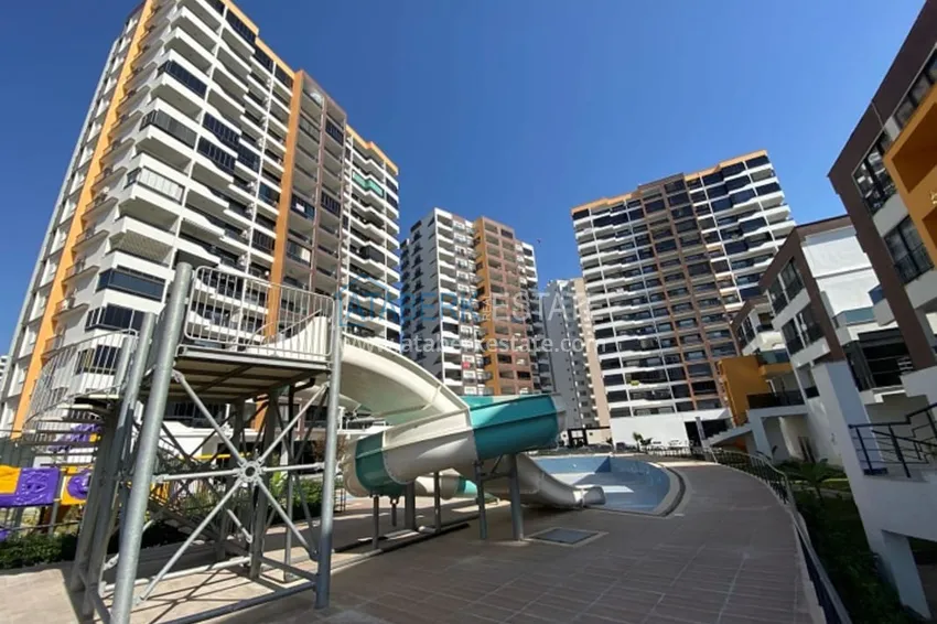 Квартира 2+1 с мебелью в молодом жилом комплексе в районе Арпачбахшиш – Мерсин 6 