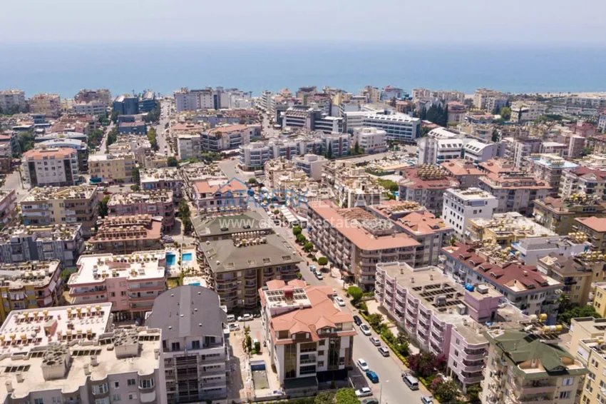 Двухкомнатная квартира с мебелью и застекленным балконом в районе Оба, Алания 1