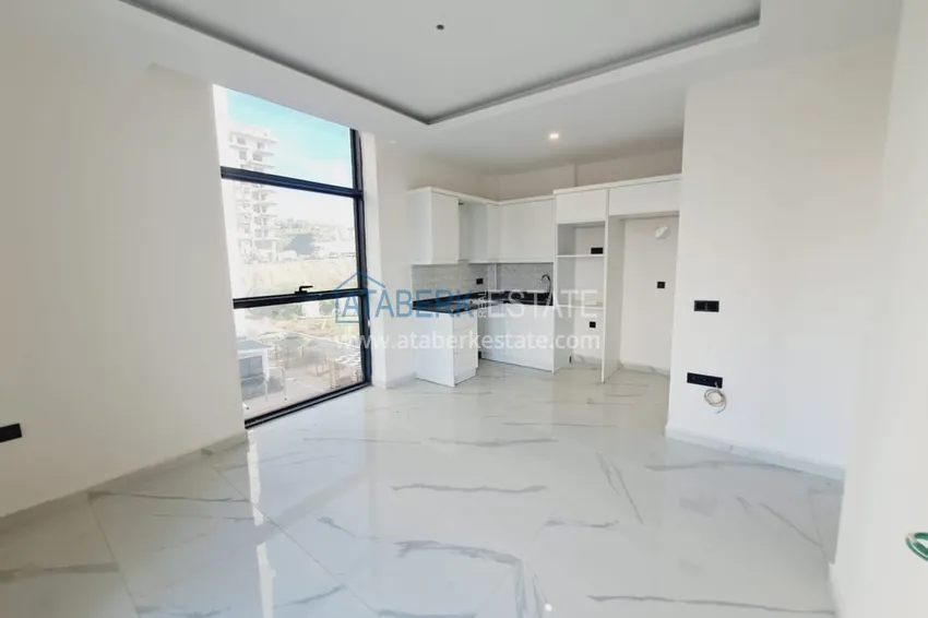 Приобрести Двухкомнатная квартира с чистовой отделкой в Махмутларе – район субботнего рынка 2 