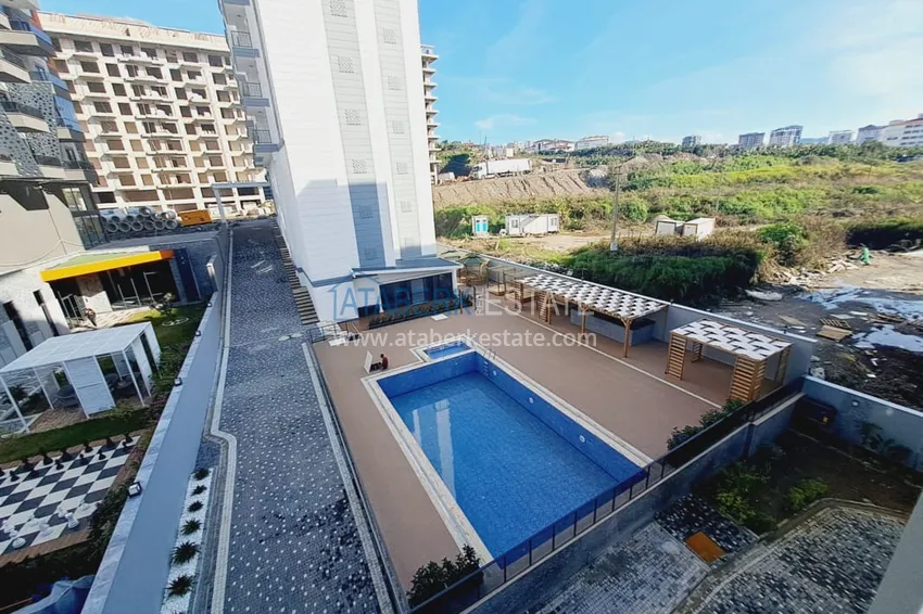 Приобрести Двухкомнатная квартира с чистовой отделкой в Махмутларе – район субботнего рынка 9 