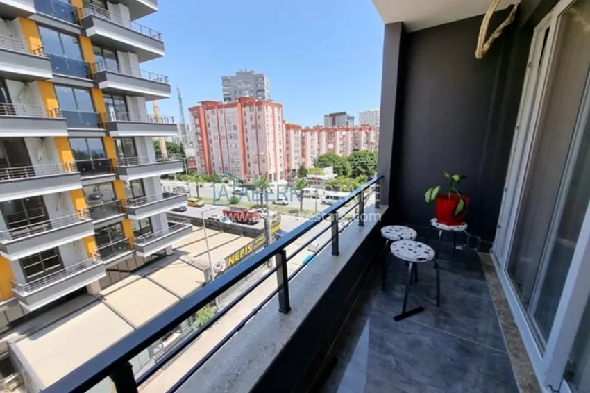 Приобрести Двухкомнатная квартира с мебелью и техникой в 100 метрах от моря район Мезитли-Мерсин 10