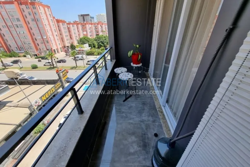 Приобрести Двухкомнатная квартира с мебелью и техникой в 100 метрах от моря район Мезитли-Мерсин 11