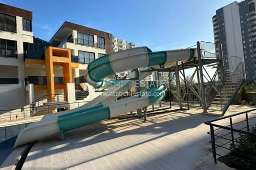 Квартира 1+1 с мебелью и техникой в жилом комплексе комфорт- класса район Арпачбахшиш-Мерсин 3 