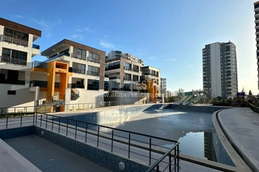 Квартира 1+1 с мебелью и техникой в жилом комплексе комфорт- класса район Арпачбахшиш-Мерсин 6 