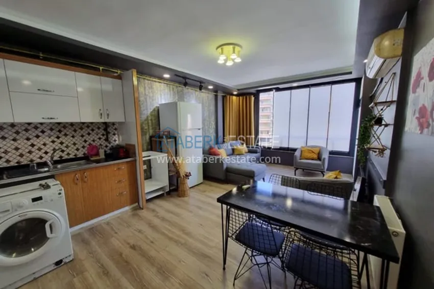 Двухкомнатная квартира с мебелью и техникой в 100 метрах от моря район Мезитли-Мерсин 1