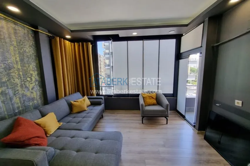 Приобрести Двухкомнатная квартира с мебелью и техникой в 100 метрах от моря район Мезитли-Мерсин 1