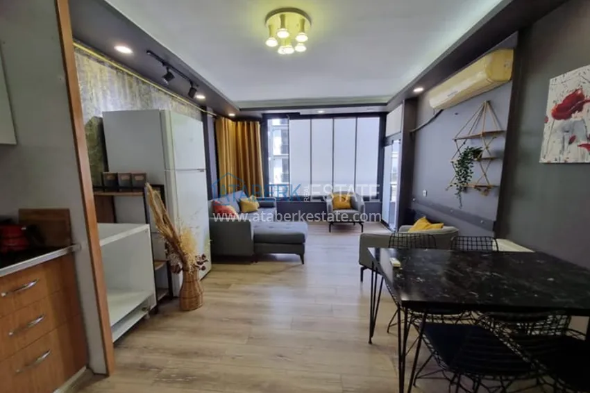 Приобрести Двухкомнатная квартира с мебелью и техникой в 100 метрах от моря район Мезитли-Мерсин 3