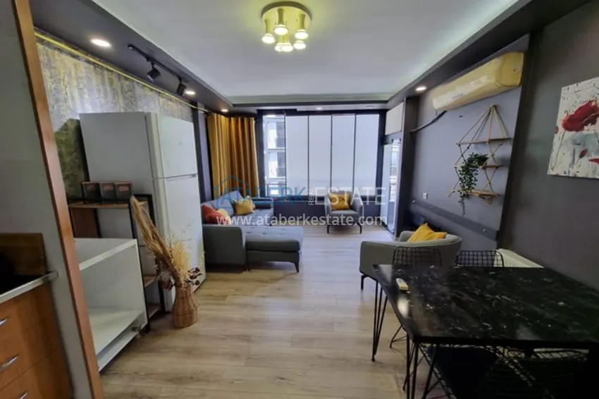 Приобрести Двухкомнатная квартира с мебелью и техникой в 100 метрах от моря район Мезитли-Мерсин 4