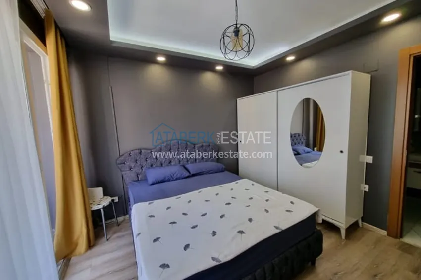 Приобрести Двухкомнатная квартира с мебелью и техникой в 100 метрах от моря район Мезитли-Мерсин 5