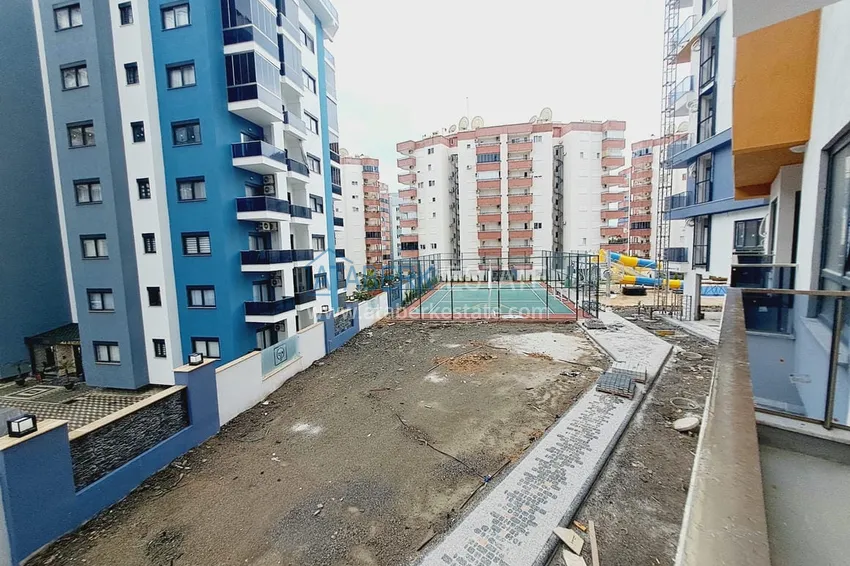 Приобрести Двухкомнатная квартира в Махмутларе с рассрочкой в новостройке 12