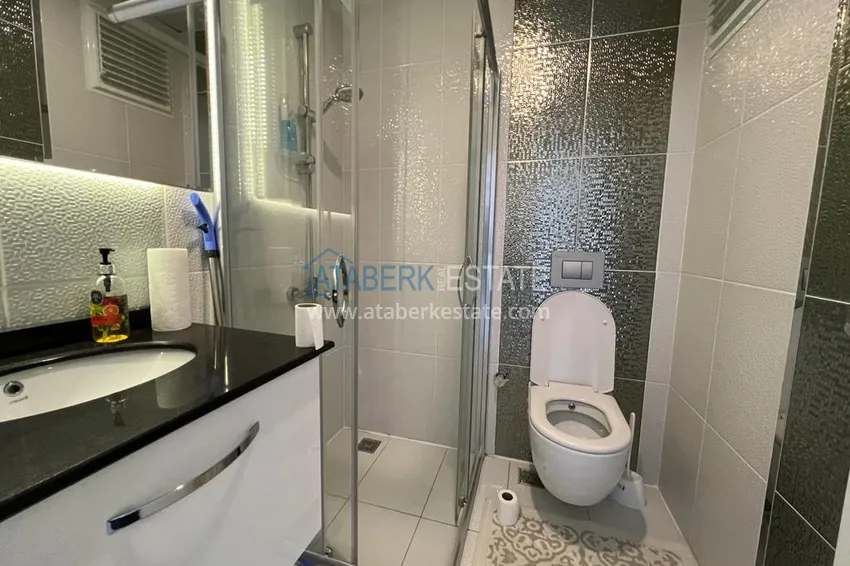 Приобрести Просторная двухкомнатная квартира с мебелью и видом на море в районе Оба, Алания 15 