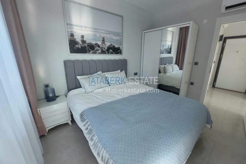 Приобрести Меблированная двухкомнатная квартира в районе Авсаллар. Новостройки Алании 19 