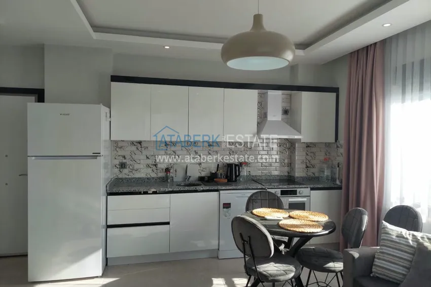 Приобрести Меблированная двухкомнатная квартира в районе Авсаллар. Новостройки Алании 3 