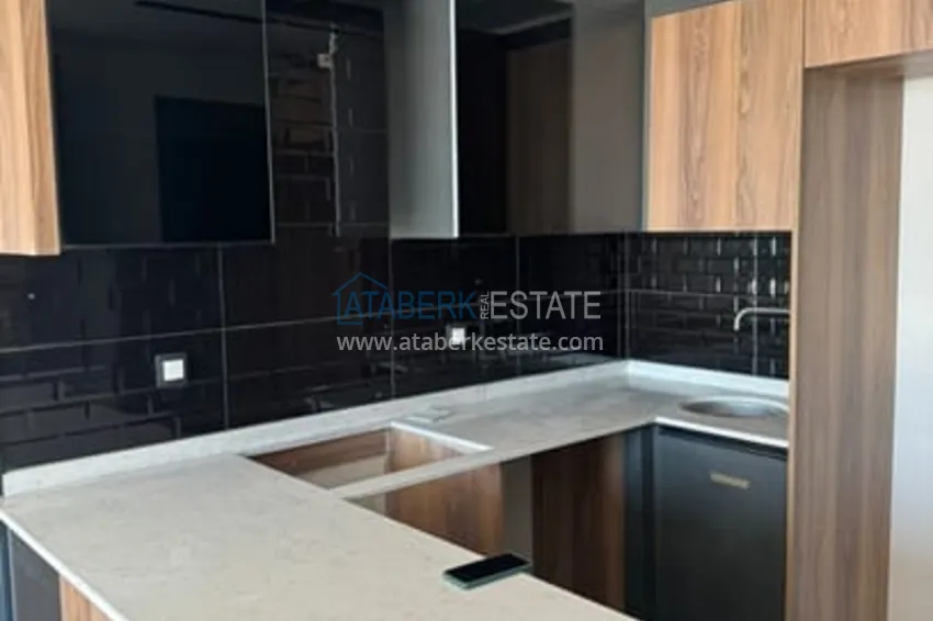 Приобрести Квартира 1+1 с чистовой отделкой и видом на море в районе Чешмели – Мерсин 2 