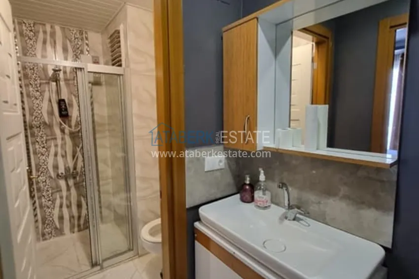 Приобрести Двухкомнатная квартира с мебелью и техникой в 100 метрах от моря район Мезитли-Мерсин 8