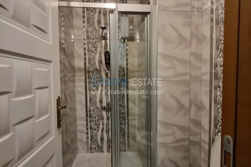 Приобрести Двухкомнатная квартира с мебелью и техникой в 100 метрах от моря район Мезитли-Мерсин 9