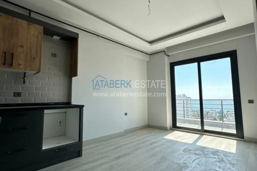 Квартира 1+1 с видом на море и чистовой отделкой район Тедже-Мерсин 1 