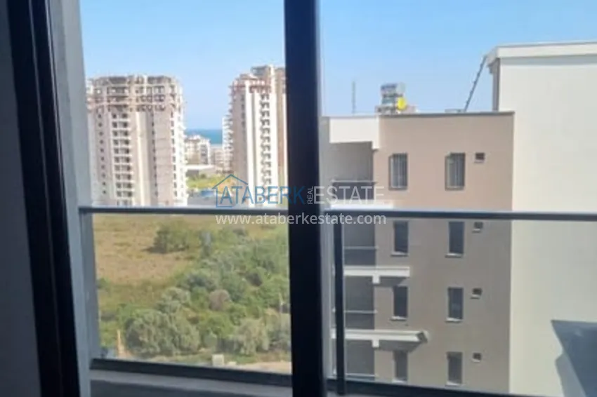 Приобрести Квартира 1+1 с чистовой отделкой и видом на море район Арпачбахшиш-Мерсин 18 