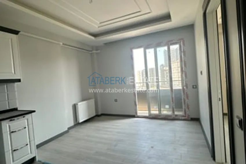 Квартира 2+1 с чистовой отделкой в жилом комплексе с инфраструктурой Мезитли-Мерсин 1 