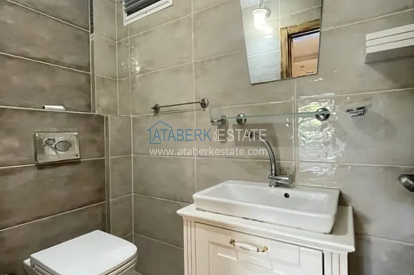 Приобрести Квартира 3+1 с отдельной кухней в 100 метрах от моря район Мезитли-Мерсин 27 