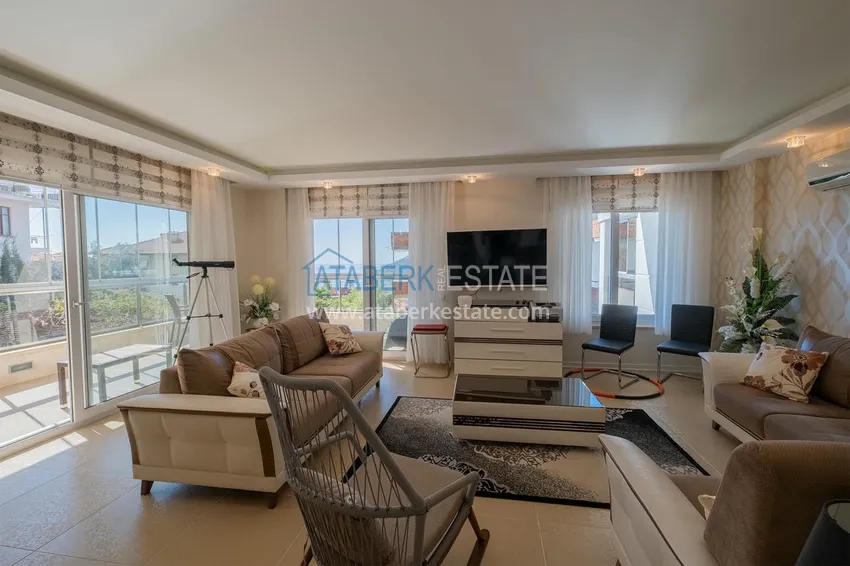 Приобрести Меблированный садовый дуплекс с двумя спальнями, застекленным балконом и видом на море в Алании 16 