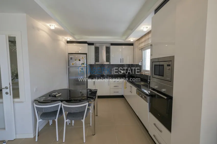 Приобрести Меблированный садовый дуплекс с двумя спальнями, застекленным балконом и видом на море в Алании 20 