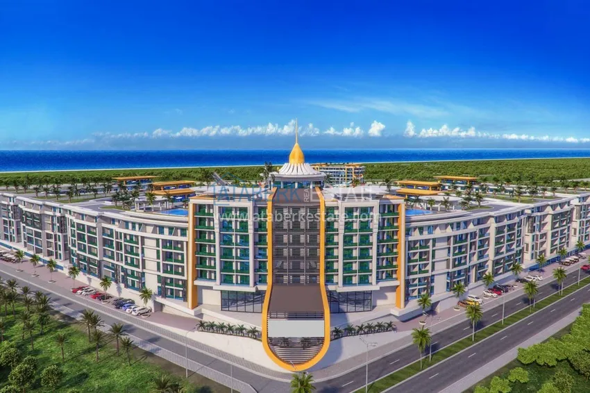 Двухкомнатная квартира 85 м2 в строящемся комплекс-отеле в Алании, район Тюрклер 1 