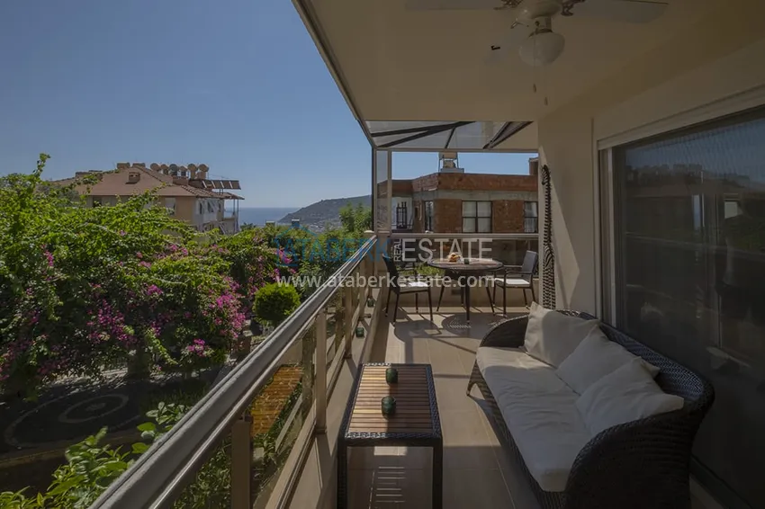 Приобрести Меблированный садовый дуплекс с двумя спальнями, застекленным балконом и видом на море в Алании 22 