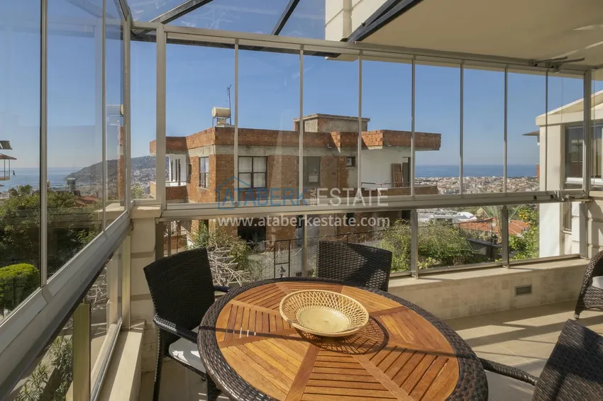 Приобрести Меблированный садовый дуплекс с двумя спальнями, застекленным балконом и видом на море в Алании 25 