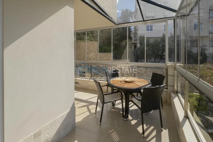 Приобрести Меблированный садовый дуплекс с двумя спальнями, застекленным балконом и видом на море в Алании 26 