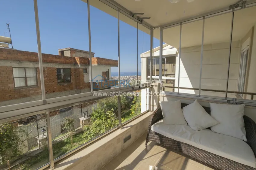 Приобрести Меблированный садовый дуплекс с двумя спальнями, застекленным балконом и видом на море в Алании 27 