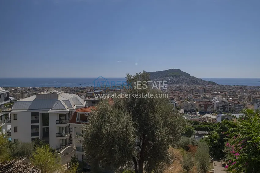 Приобрести Меблированный садовый дуплекс с двумя спальнями, застекленным балконом и видом на море в Алании 28 