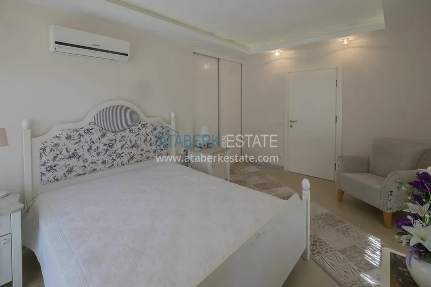 Приобрести Меблированный садовый дуплекс с двумя спальнями, застекленным балконом и видом на море в Алании 32 