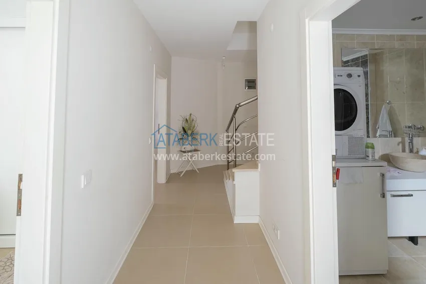 Приобрести Меблированный садовый дуплекс с двумя спальнями, застекленным балконом и видом на море в Алании 33 