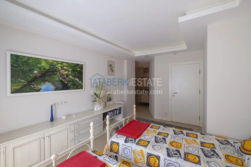 Приобрести Меблированный садовый дуплекс с двумя спальнями, застекленным балконом и видом на море в Алании 37 