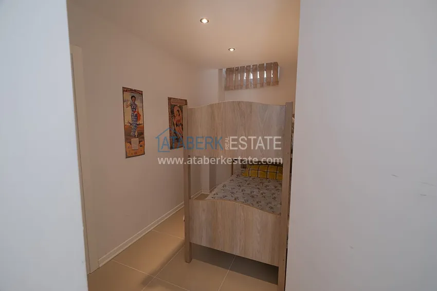 Приобрести Меблированный садовый дуплекс с двумя спальнями, застекленным балконом и видом на море в Алании 38 