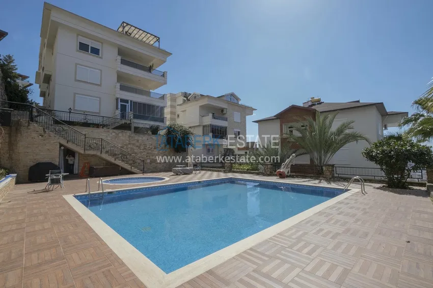 Меблированный садовый дуплекс с двумя спальнями, застекленным балконом и видом на море в Алании 2 