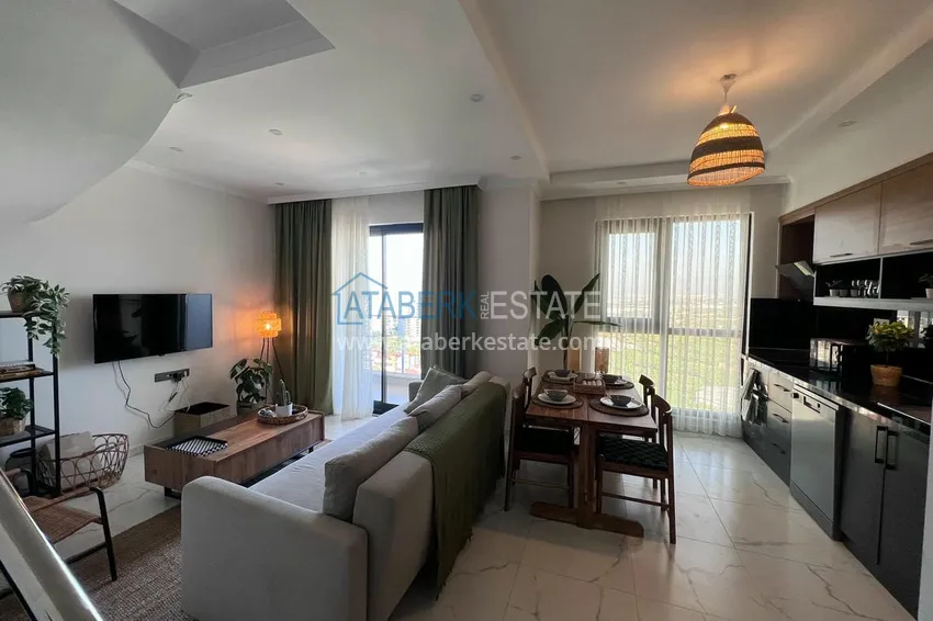 Приобрести Двухуровневый пентхаус «под ключ» с открытым видом на море и горы – новостройки Алании, район Махмутлар 2 