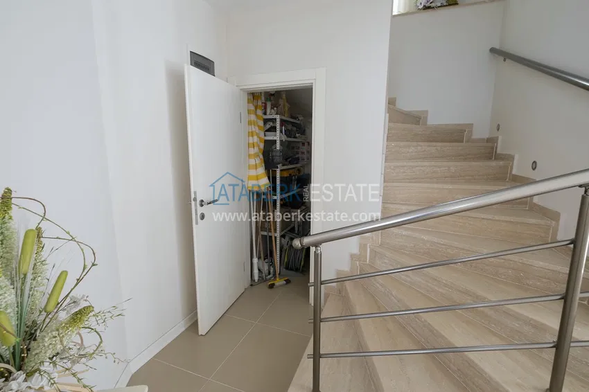 Приобрести Меблированный садовый дуплекс с двумя спальнями, застекленным балконом и видом на море в Алании 42 