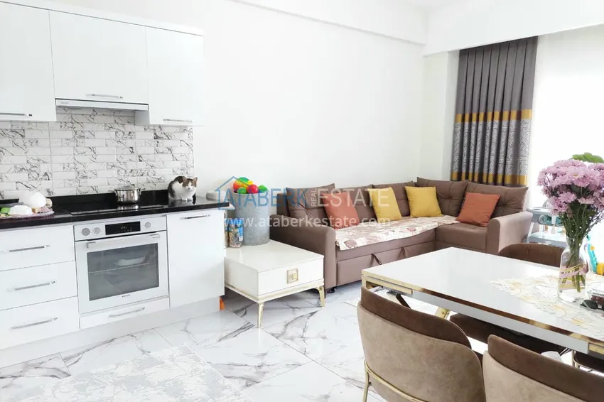 Приобрести Двухкомнатная квартира под ключ с застекленным балконом в Алании, район Авсаллар. Доступна рассрочка 4 