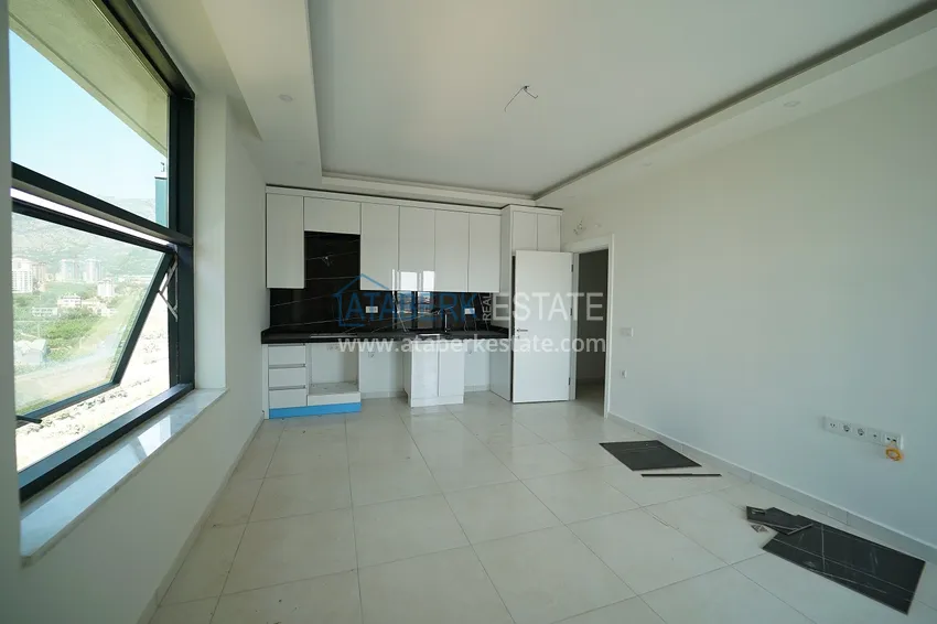 Приобрести Квартиры и пентхаусы с чистовой отделкой различных планировок в районе Махмутлар – Новостройка  13 